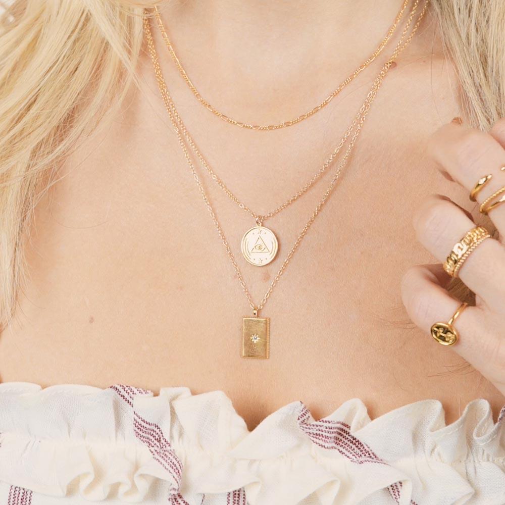 A close up picture of Katie Dean wearing the All Seeing Eye & Rectangle necklaces by Katie Dean Jewelry.