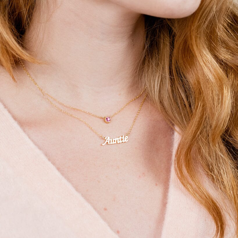 Picture of a model wearing the dainty gold Auntie Necklace, made in America by Katie Dean Jewelry