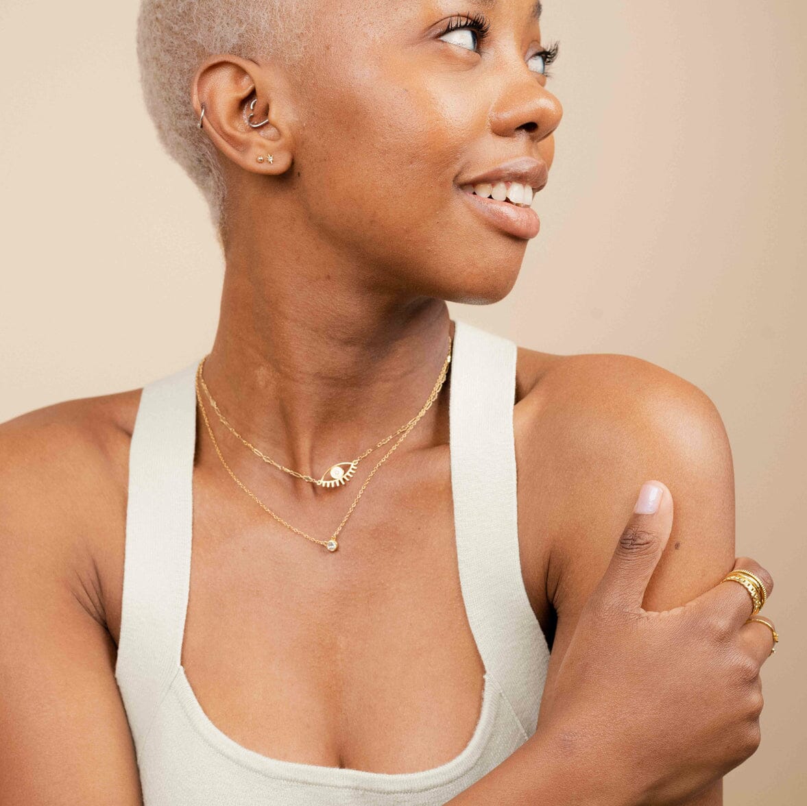 Dainty gold Evil Eye Necklace as seen on a model, made in America by Katie Dean Jewelry