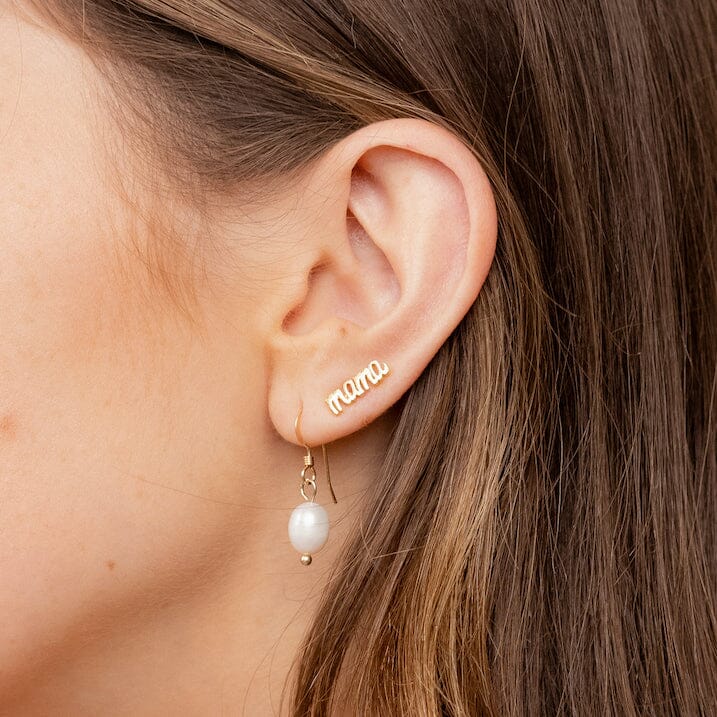 The Mama-studs-earrings-dainty-gold-katie-dean-jewelry as seen on a model with the pearl earrings.