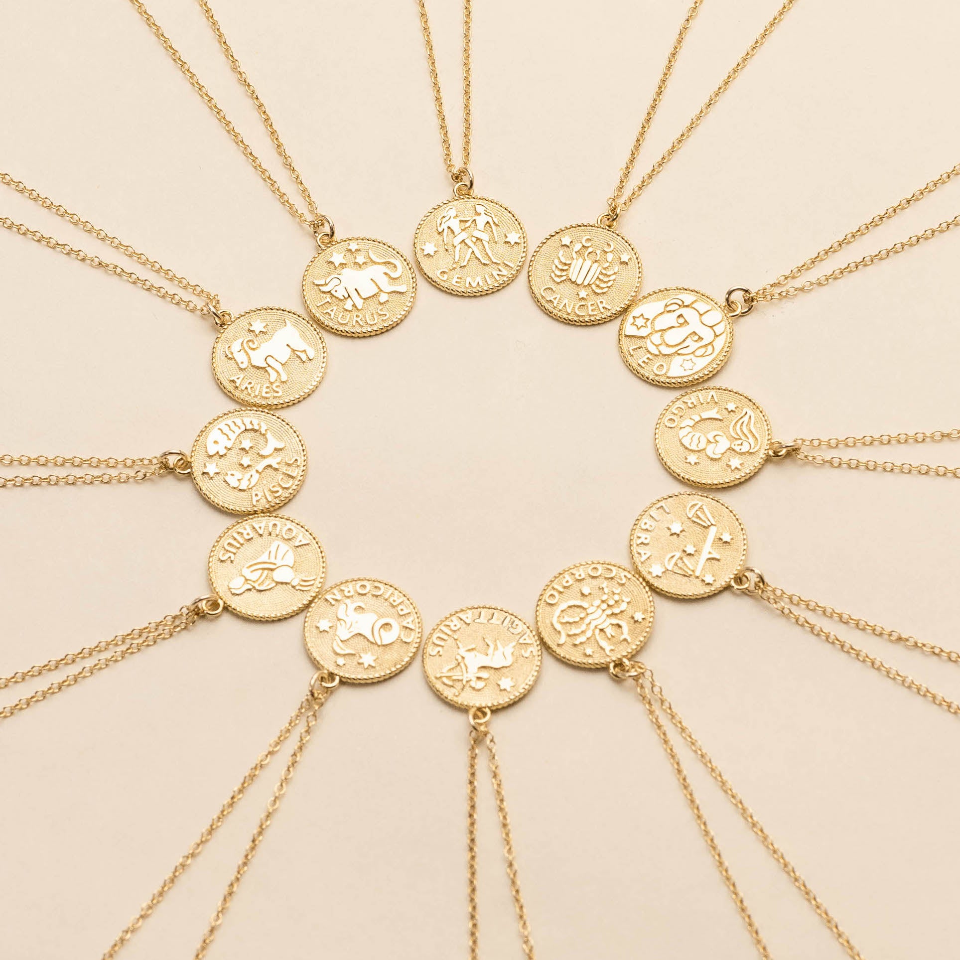 Zodiac horoscope necklace Collection, dainty gold handmade necklaces by Katie Dean Jewelry shown in a circular formation