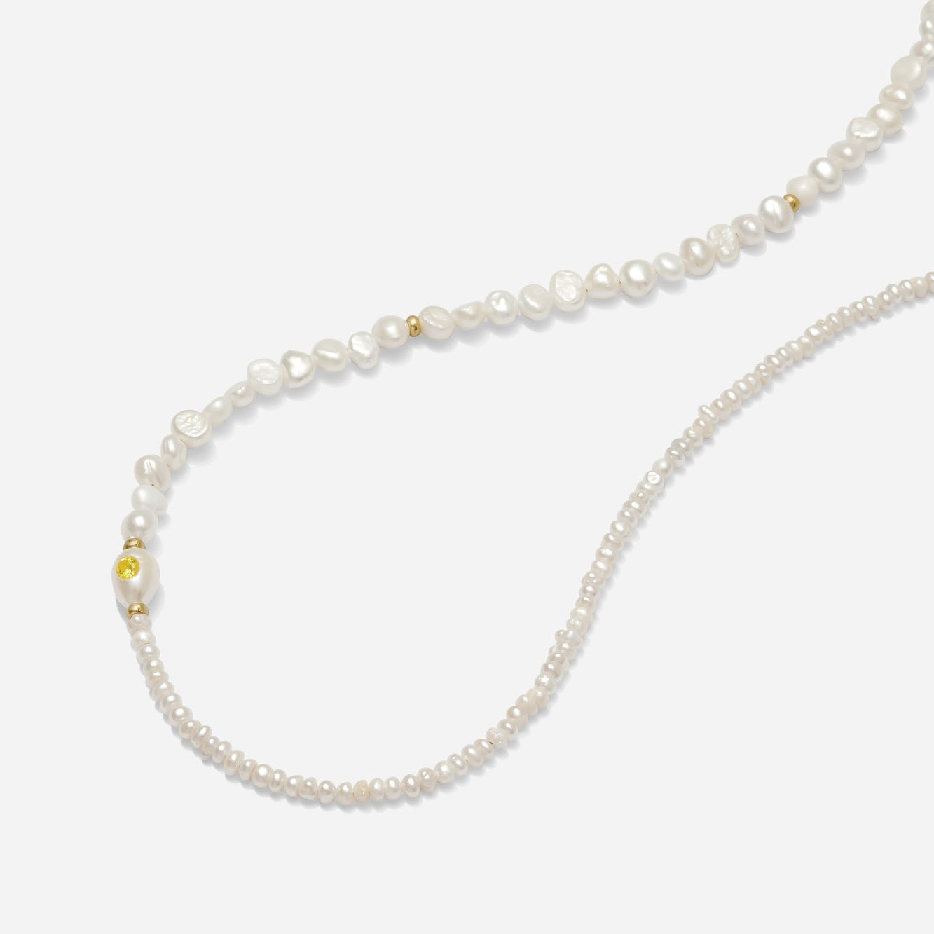 Asymmetrical freshwater pearl necklace with gold accents hand beaded by Katie Dean Jewelry in America.