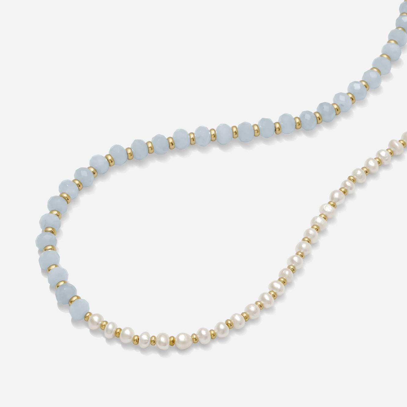 Asymmetrical Pearl & Blue Gemstone Necklace handmade by katie dean jewelry on a white background.