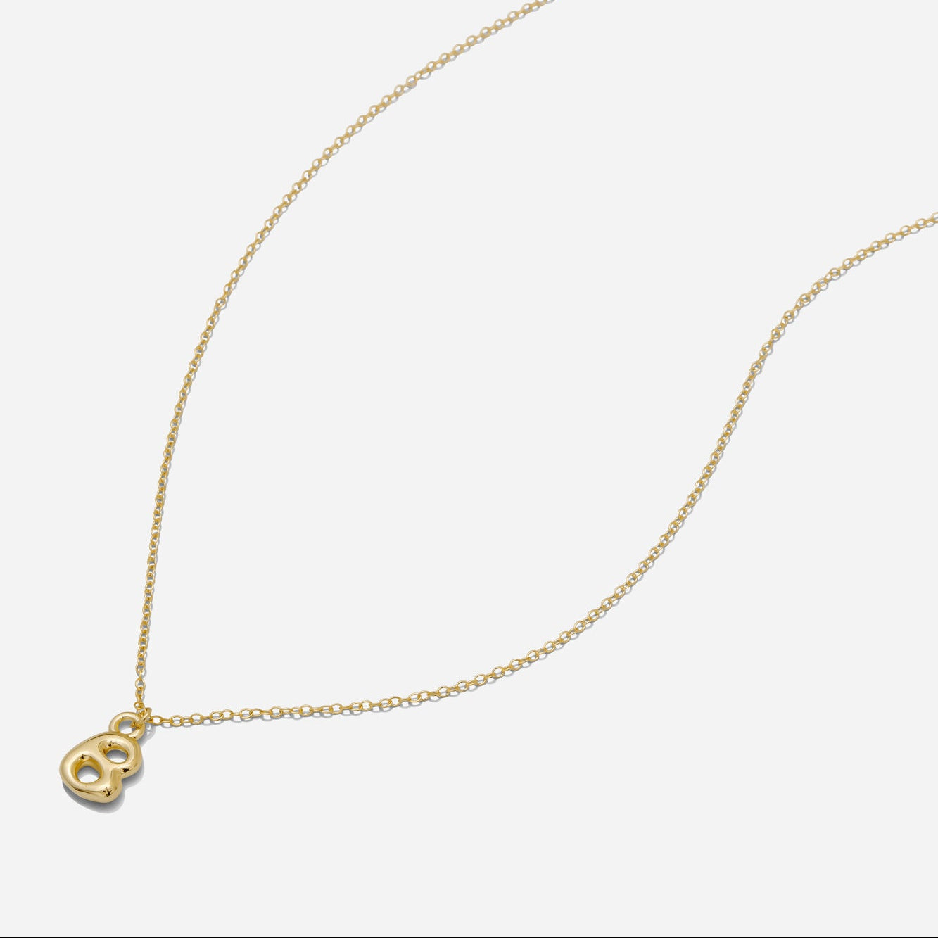 Dainty Gold puffy initial "B" pendant necklace on an 18-inch gold filled chain as seen on a white background.