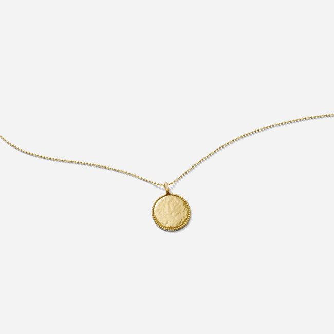 The Beaded Coin Necklace as seen on a white background by Katie Dean Jewelry. Made in America.