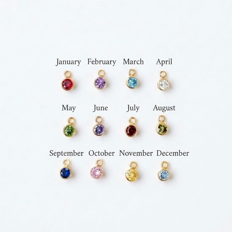 gold birthstone charms on a white background.