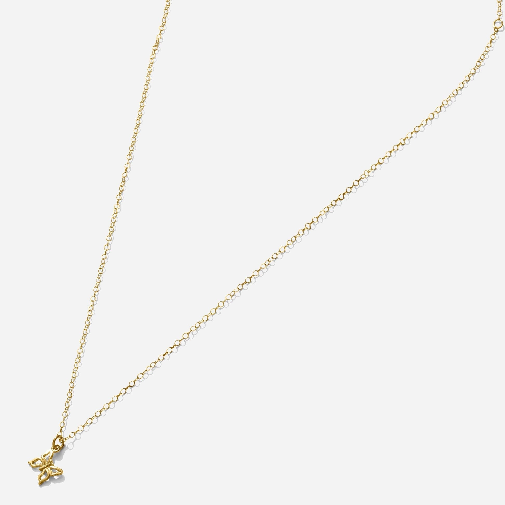 Gold Butterfly Necklace handmade in America by Katie Dean Jewelry, as seen on a natural white background, perfect for the dainty minimal jewelry lovers.