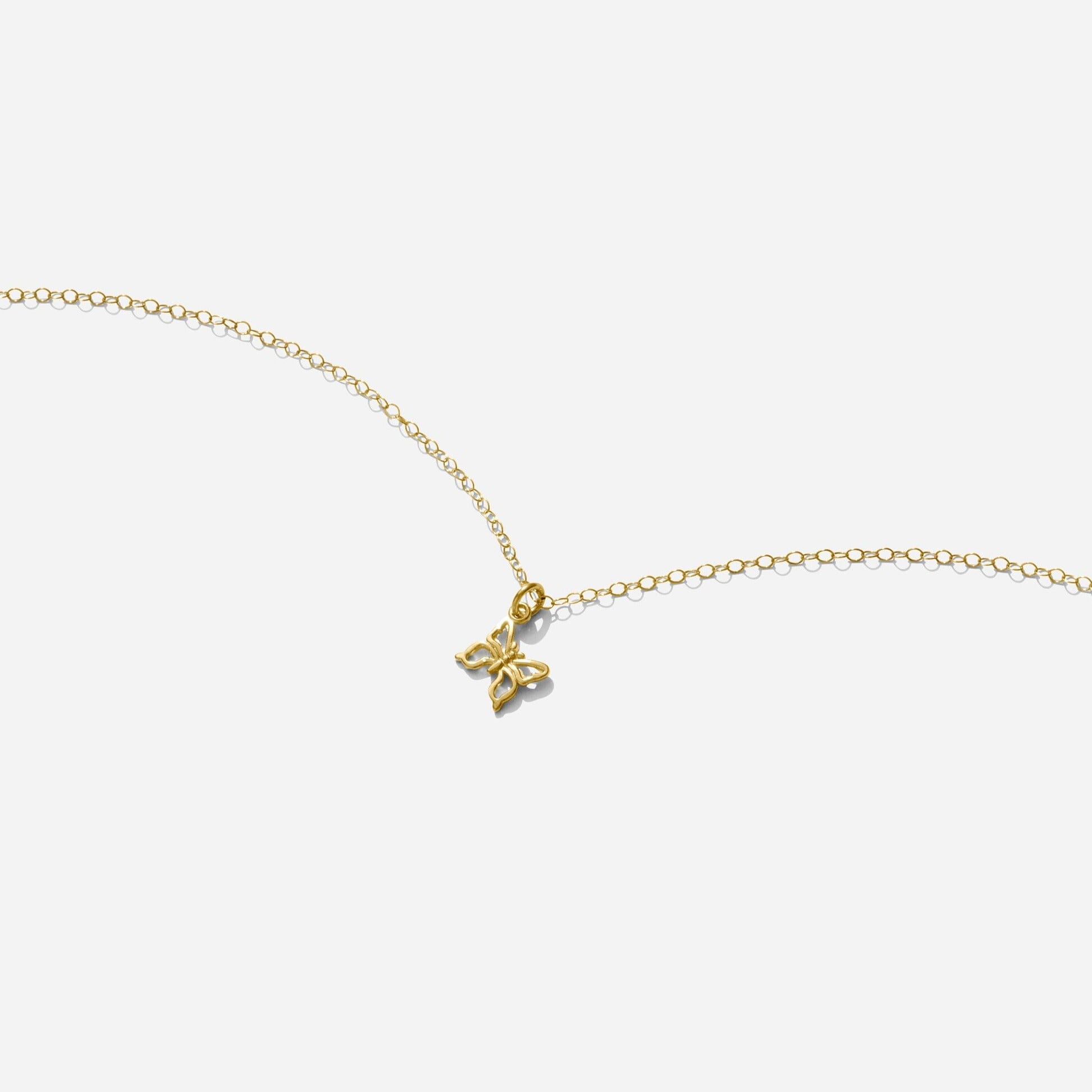 Gold Butterfly Necklace handmade in America by Katie Dean Jewelry, as seen on a natural white background, perfect for the dainty minimal jewelry lovers.