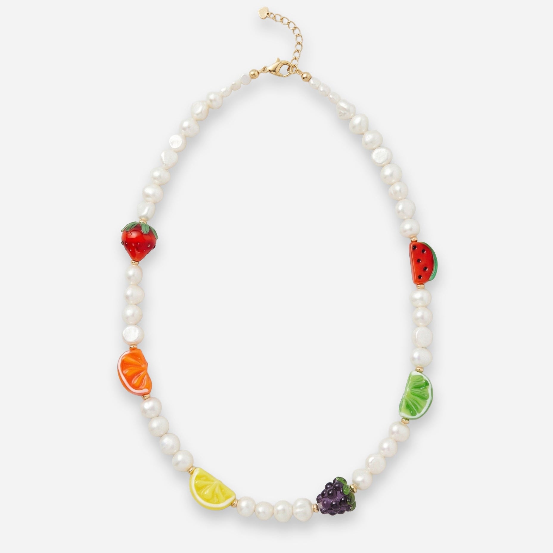 Necklace with fruit-shaped glass beads and pearl beads on a white background and gold clasp.
