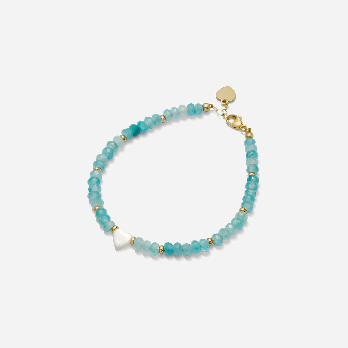 Turquoise beaded bracelet with gold fill bead accents and a dainty white pearl heart charm on a white background, handmade by Katie Dean Jewelry in Clearwater, Florida.