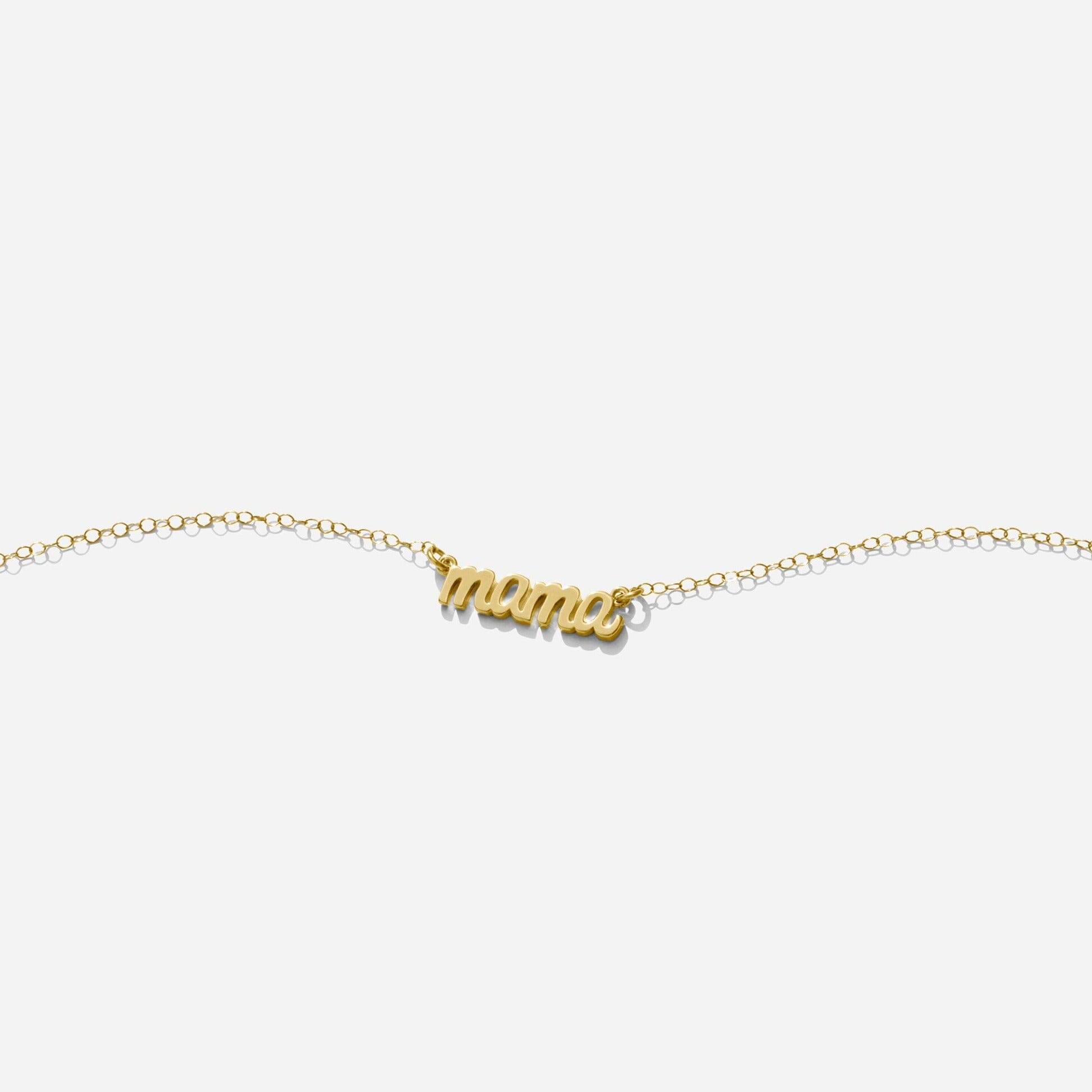 Gold Mama Necklace handmade in America by Katie Dean Jewelry, made in America as seen on a natural white background, perfect for the dainty minimal jewelry lovers.