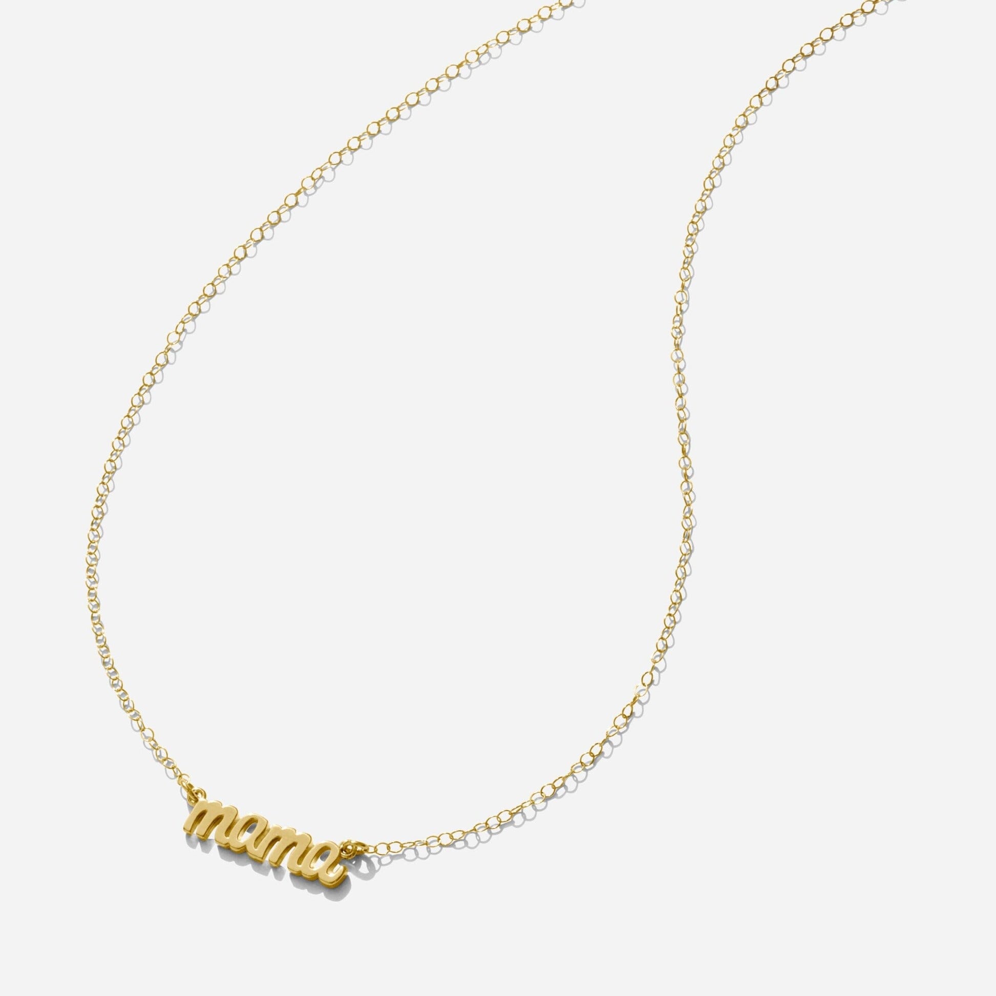 Gold Mama Necklace handmade in America by Katie Dean Jewelry, made in America as seen on a natural white background, perfect for the dainty minimal jewelry lovers.