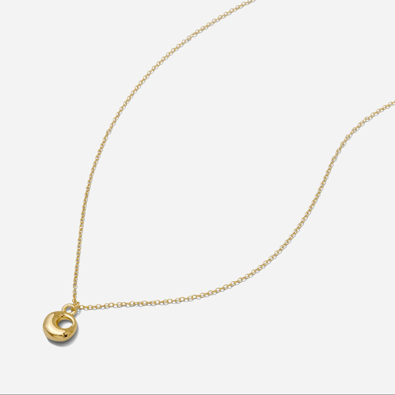 Dainty Gold puffy initial "O" pendant necklace on an 18-inch gold filled chain as seen on a white background.