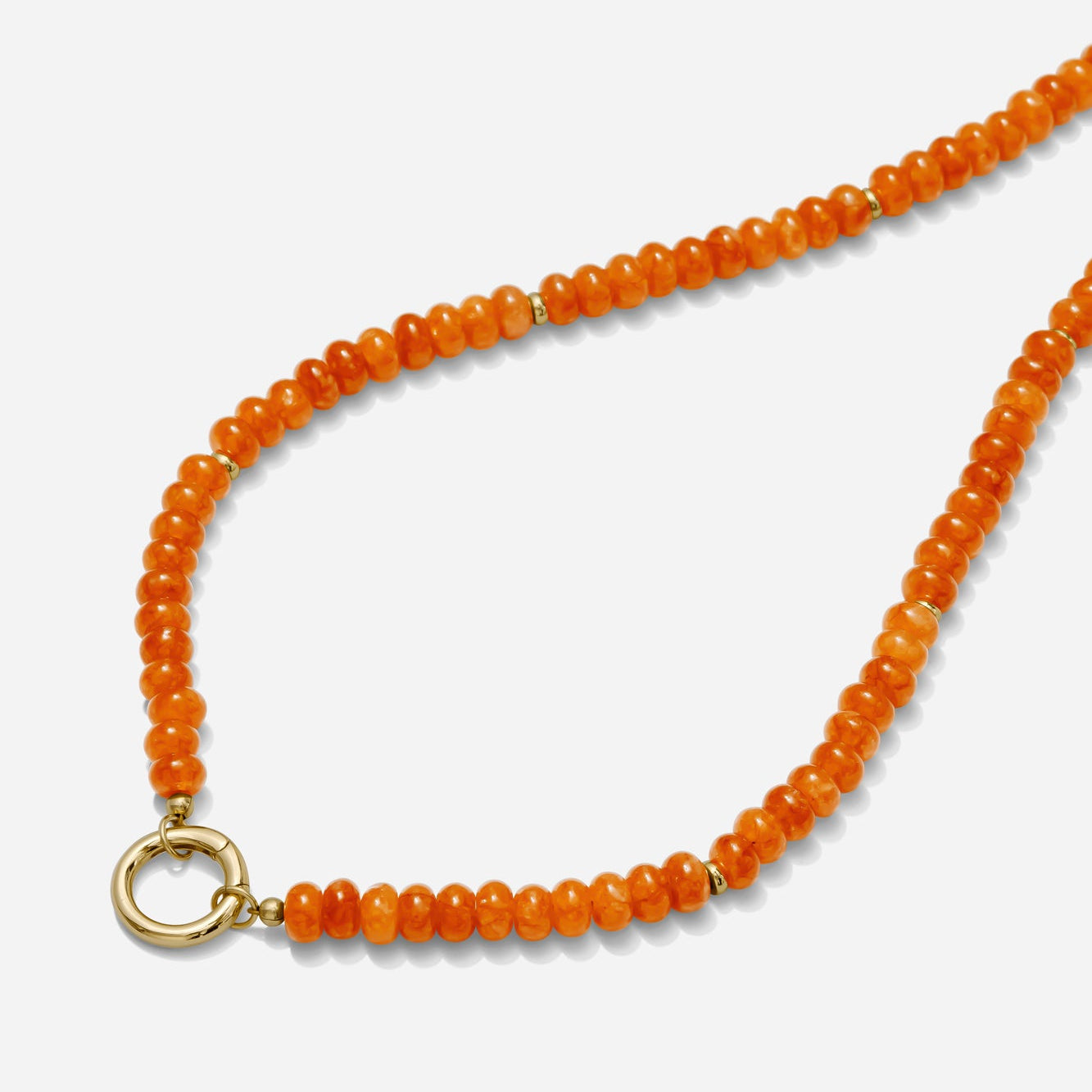 Orange beaded necklace with a gold carabiner clasp on a white background handmade by Katie Dean Jewelry