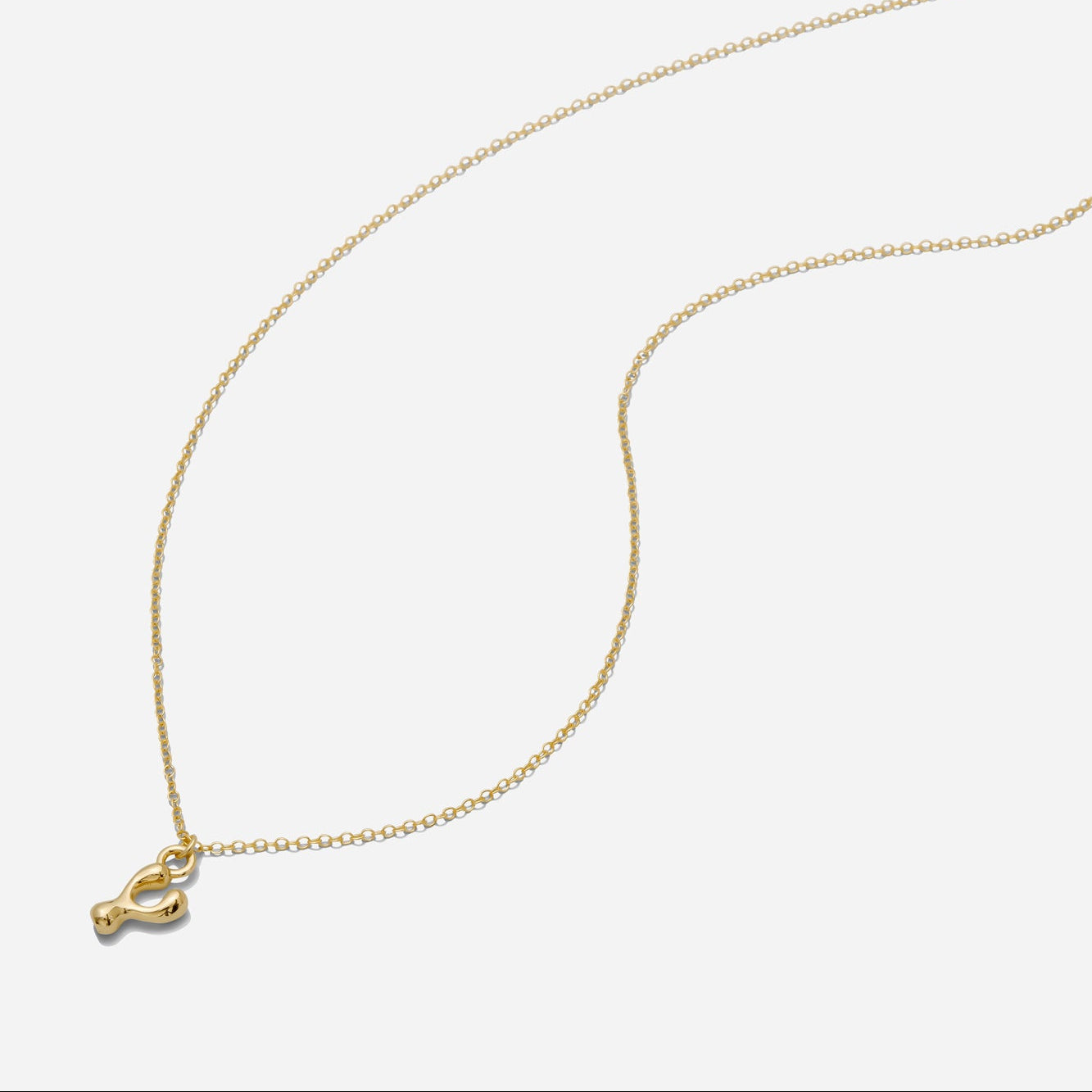 Dainty Gold puffy initial "Y" pendant necklace on an 18-inch gold filled chain as seen on a white background.
