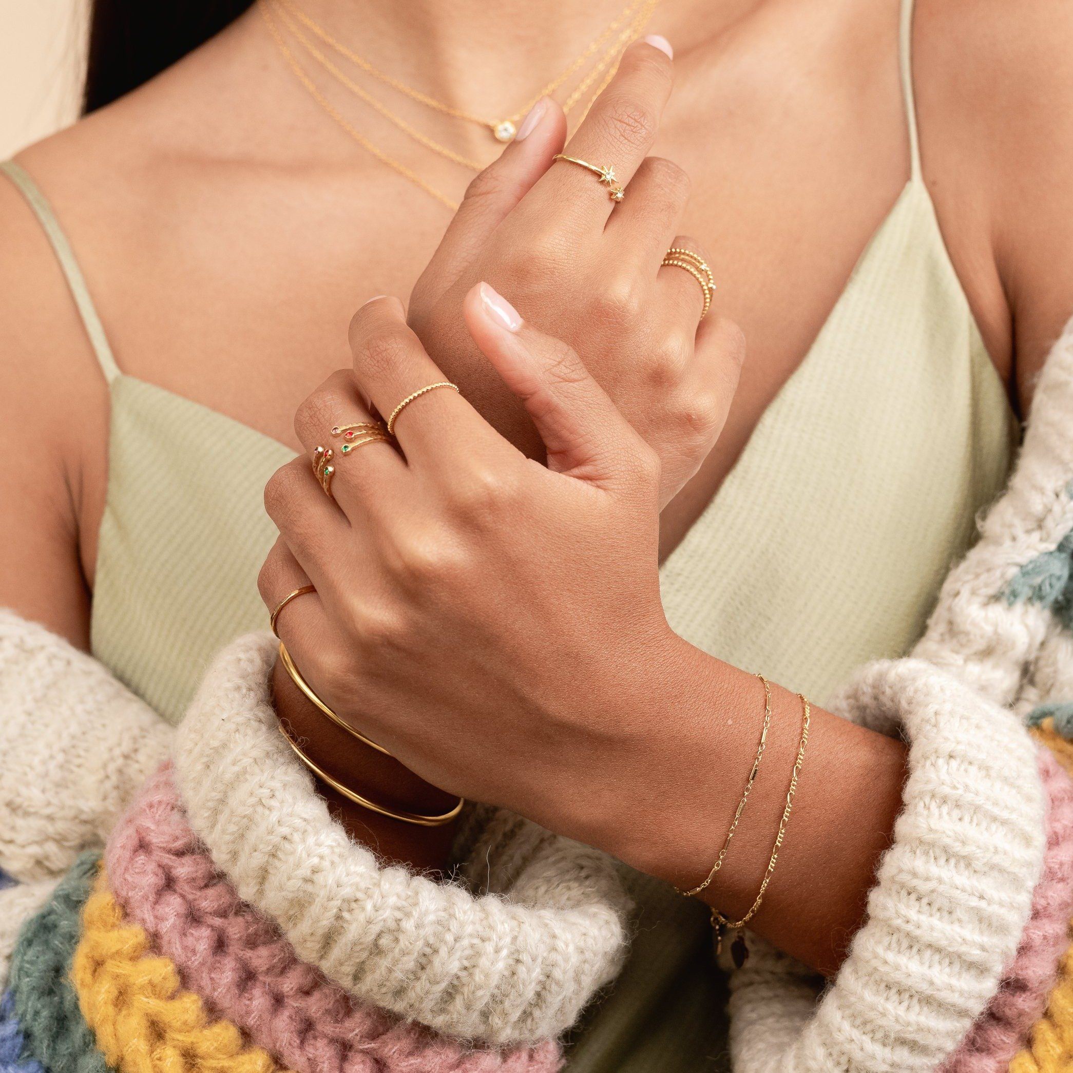 The Everyday Bracelet Set, includes one Figaro Chain bracelet and one Linked Bracelet.