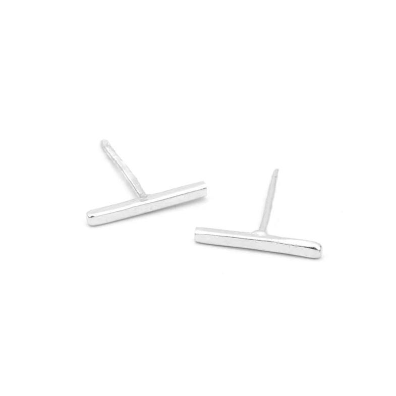 Up close image of silver Bar Studs against white background.