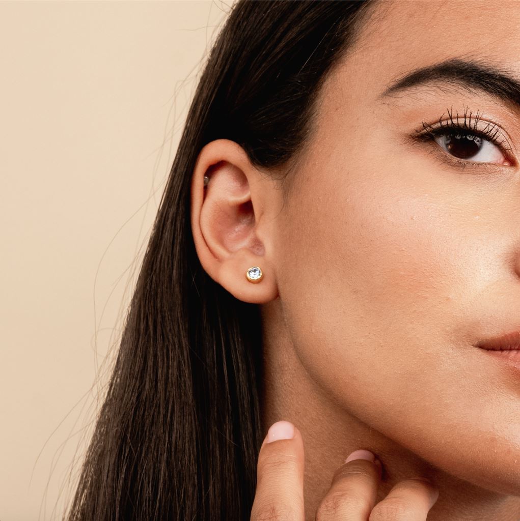 Dainty Birthstone Stud Earrings shown on model, handmade in California by Katie Dean Jewelry. Nickel Free and hypoallergenic.