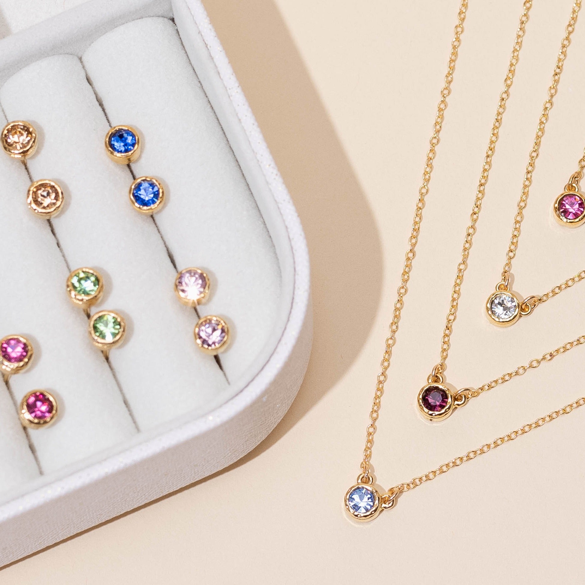 Dainty gold Birthstone Necklaces and Earrings. Minimal layering jewelry handmade in America by Katie Dean Jewelry.