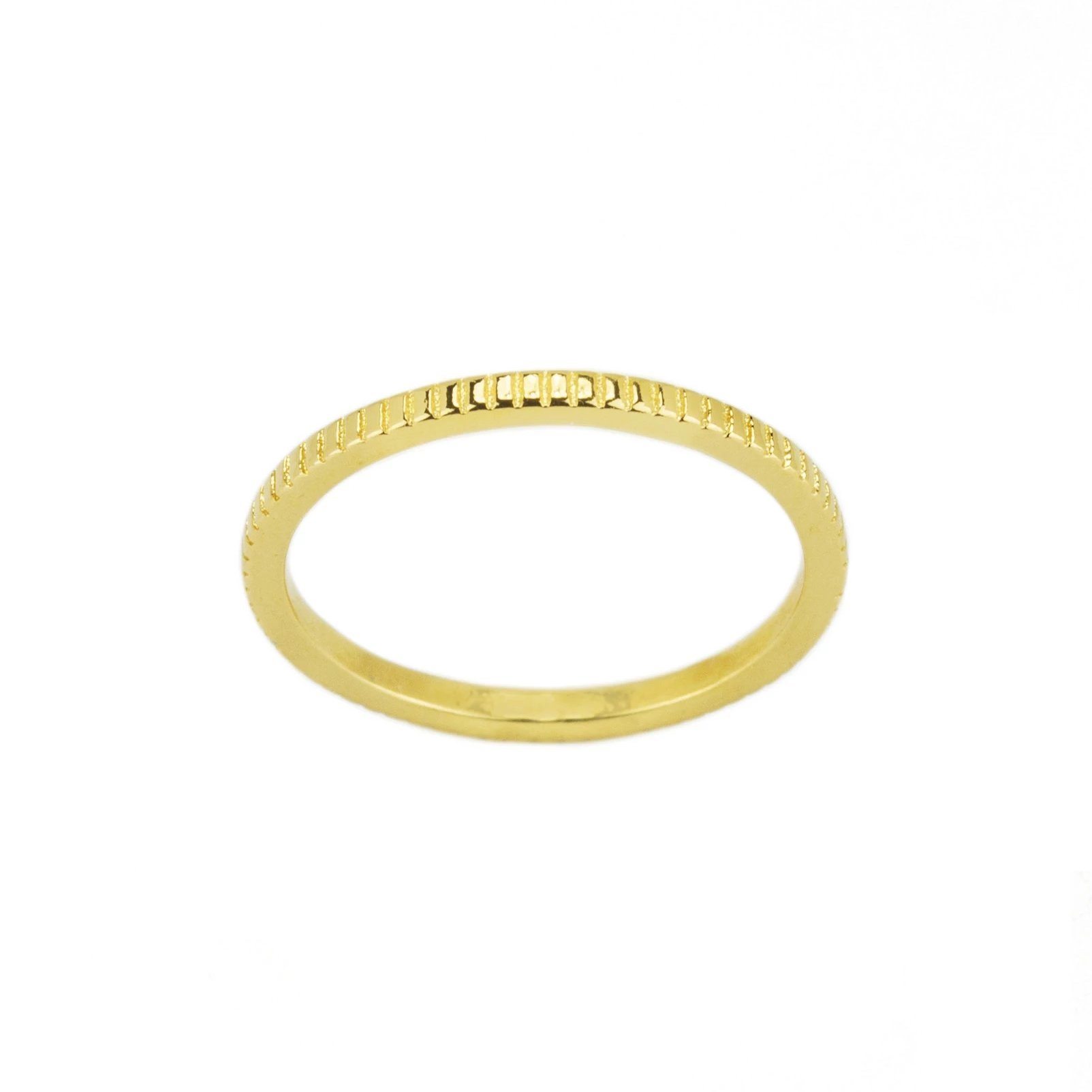 Putting a twist on the classic band ring with some intricate coin details. Perfect for your next stacking ring.