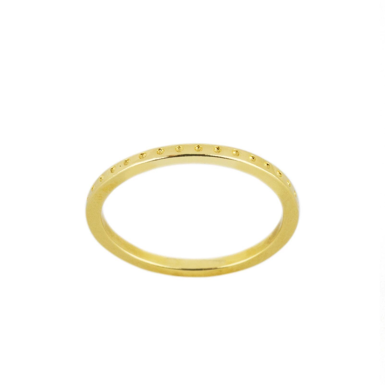 A lovely stacking ring, the Dotted Ring is perfect for the minimalist who wants to add a little texture to their ring look. Handmade in California by Katie Dean Jewelry.