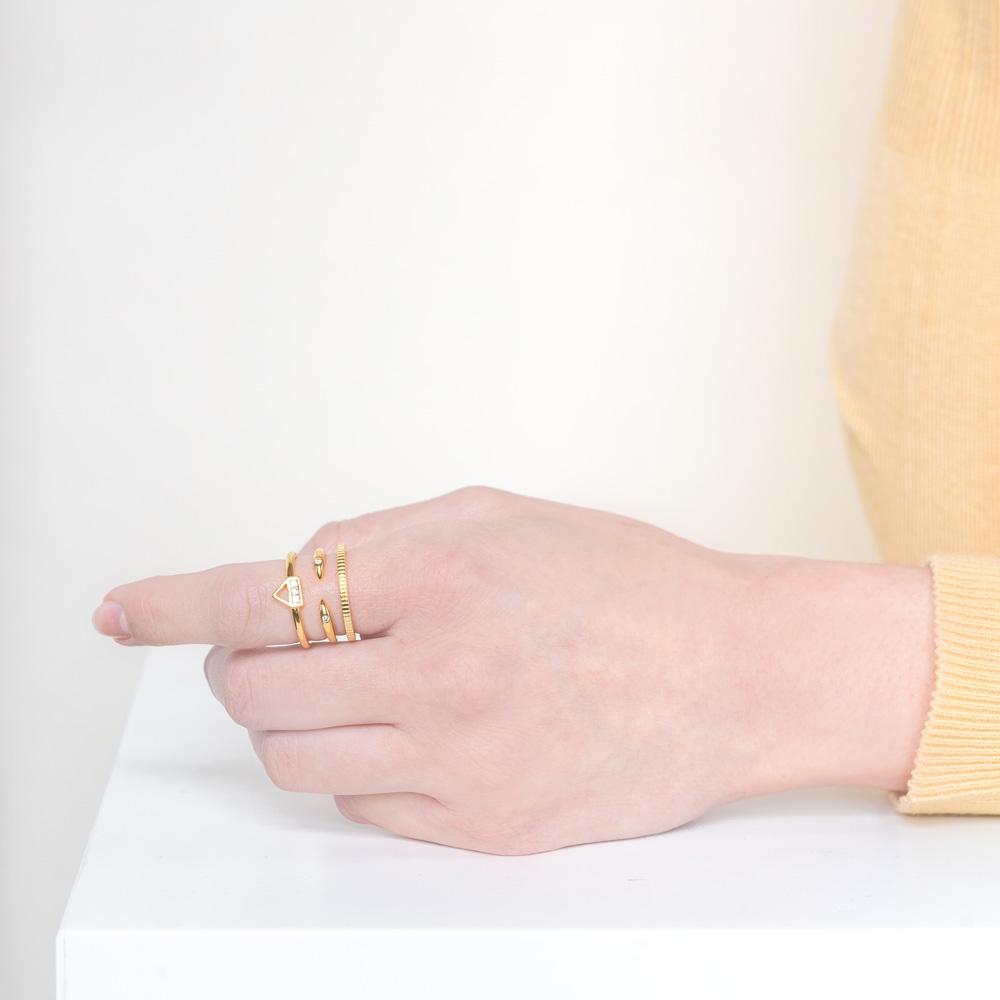 The Essential Ring Stack is one you won't want to take off. Included in this ring set: the Coin Ring, Claw Ring and the Love Triangle Ring. Handmade in California by Katie Dean Jewelry.