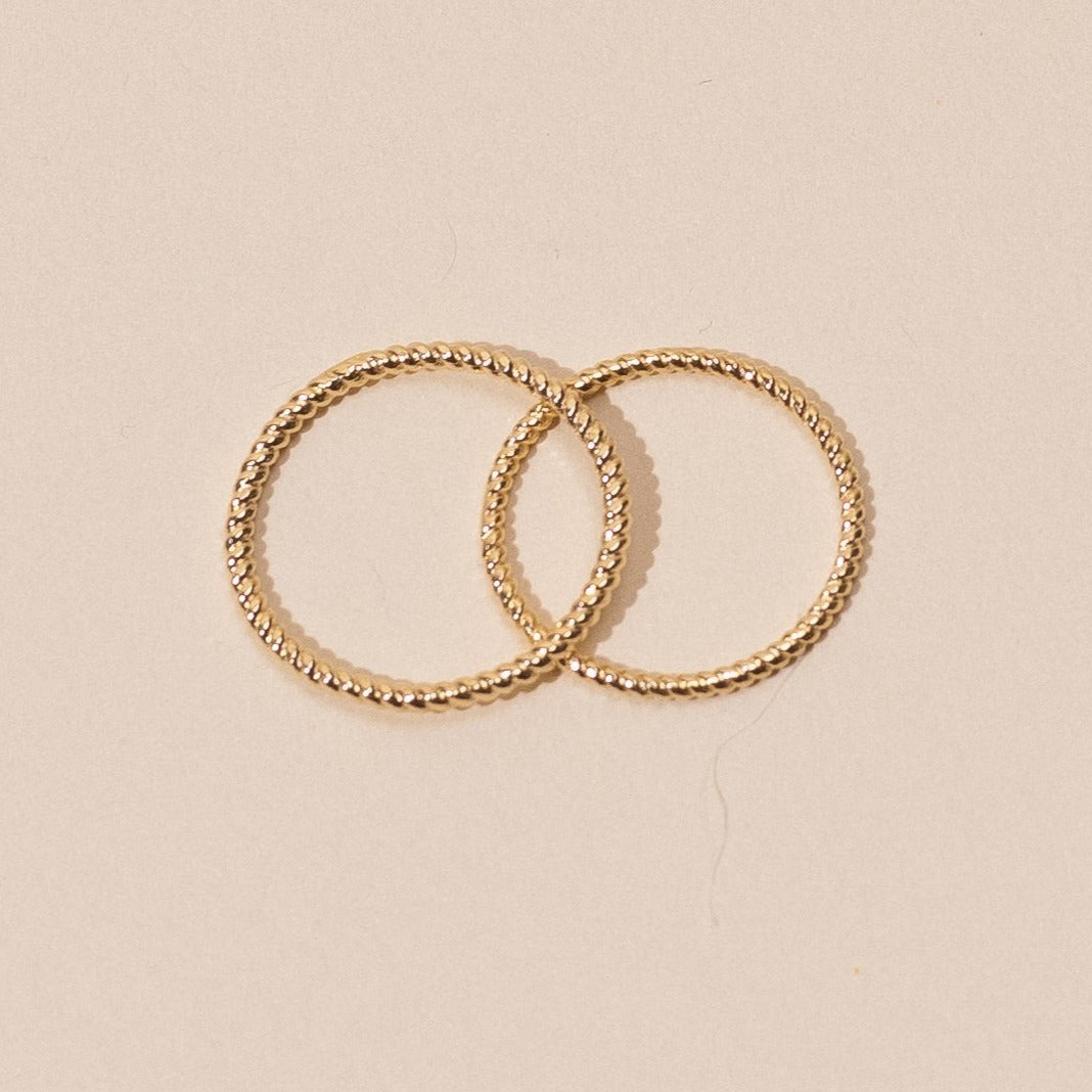 Dainty minimal Spiral Stacking Ring, handmade in America by Katie Dean Jewelry, gold plated over brass.