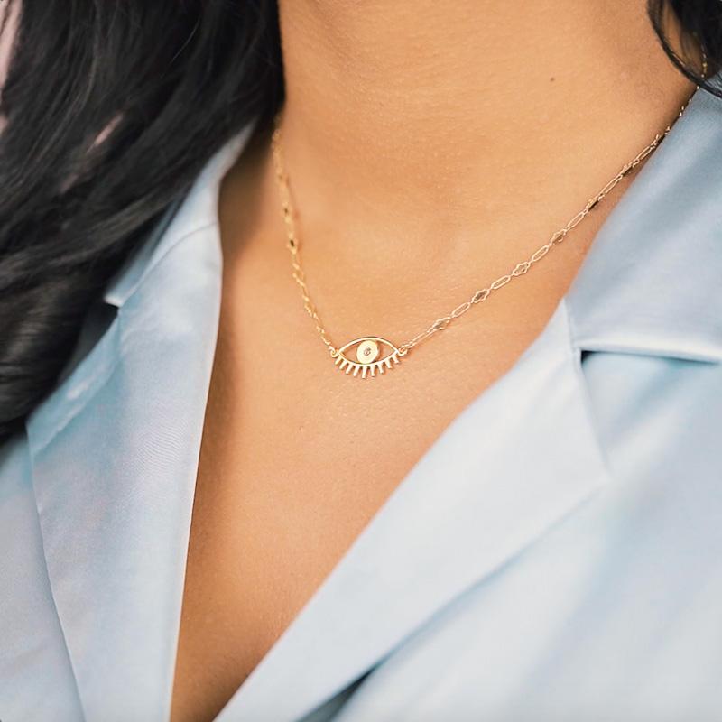 Keeping all bad juju away from you! Let this intricate yet minimal Evil Eye Necklace protect you from bad vibes and spread the love to one and all. Handmade in California.