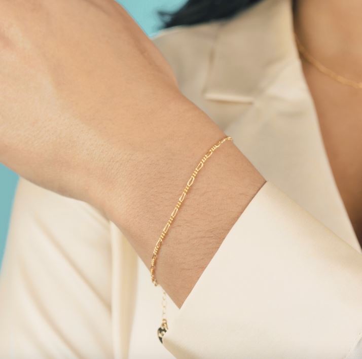 Simple and classic. The Figaro Chain Bracelet is the perfect dainty bracelet to pair up with your order dainty chain bracelets. Handmade in California by Katie Dean Jewelry.