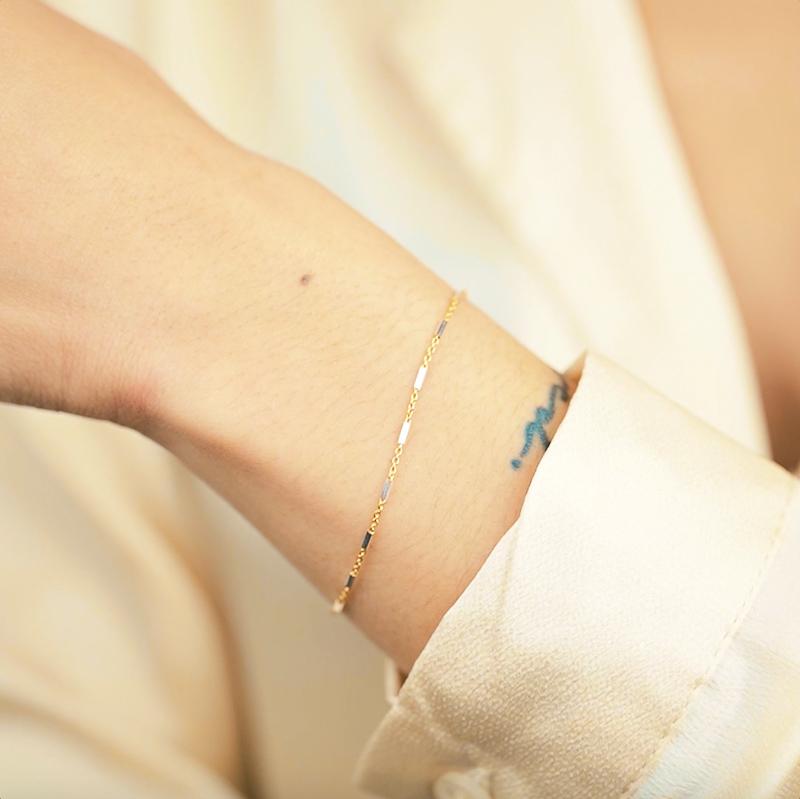 Silver and gold came together to form the perfect friendship in the form of this dainty bracelet. Silver and gold lovers alike agree on this one! Handmade in California by Katie Dean Jewelry.