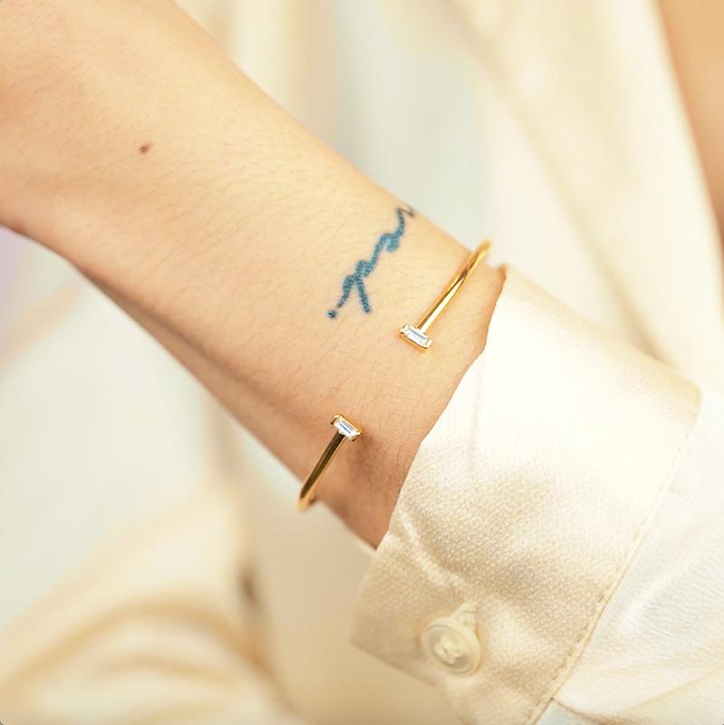 Model wearing the gold Baguette Cuff. Handmade in California by Katie Dean Jewelry.
