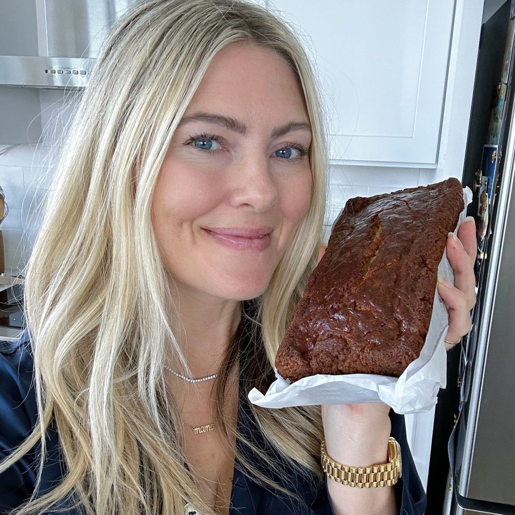 Jewelry designer Katie Dean holding up her family recipe Chocolate Chip Banana Bread