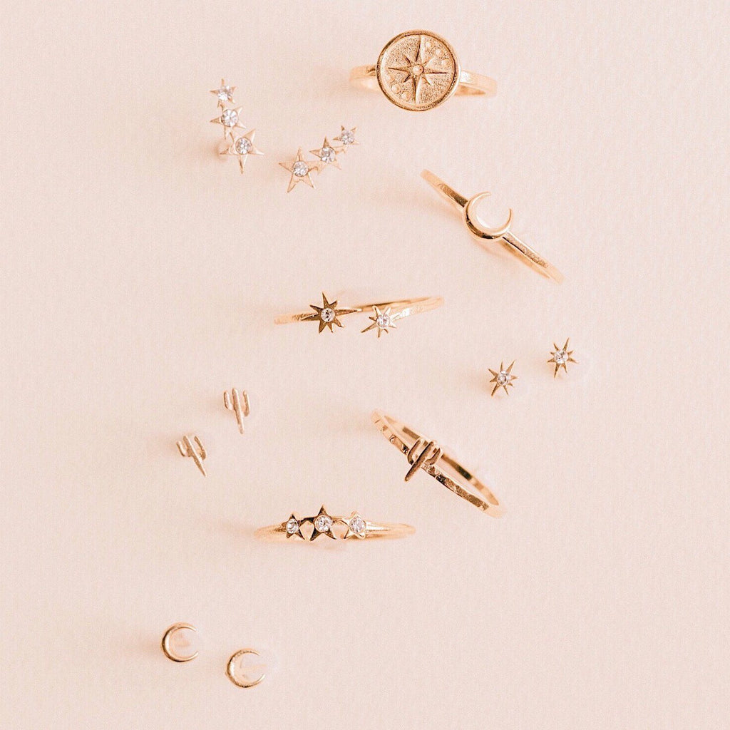 Dainty rings flatlay on pink, Little Dipper, Moon, Starburst, handmade by Katie Dean Jewelry