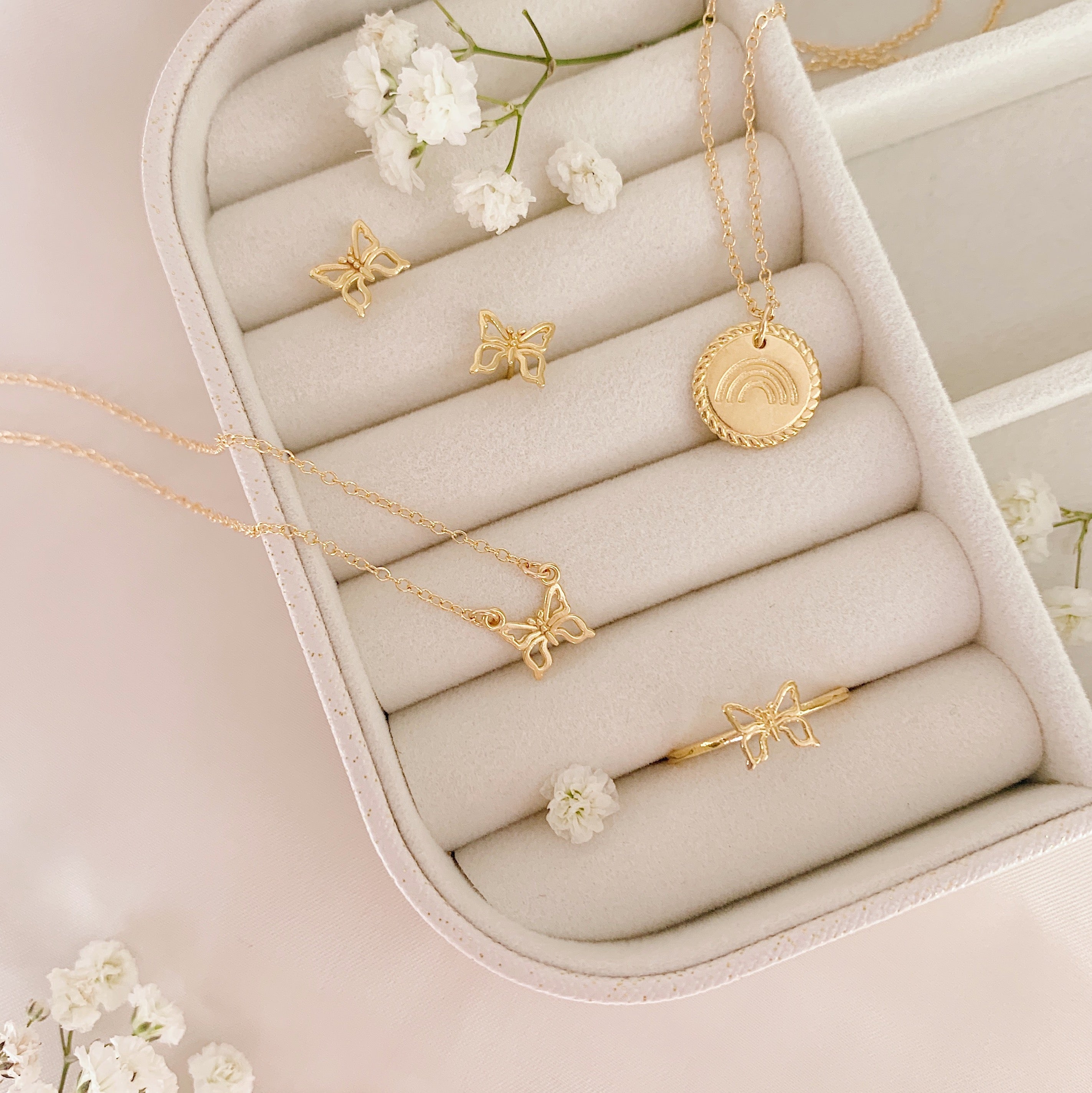 Rainbow butterfly collection in white jewelry case_dainty minimal gold jewelry, handmade in America by Katie Dean Jewelry