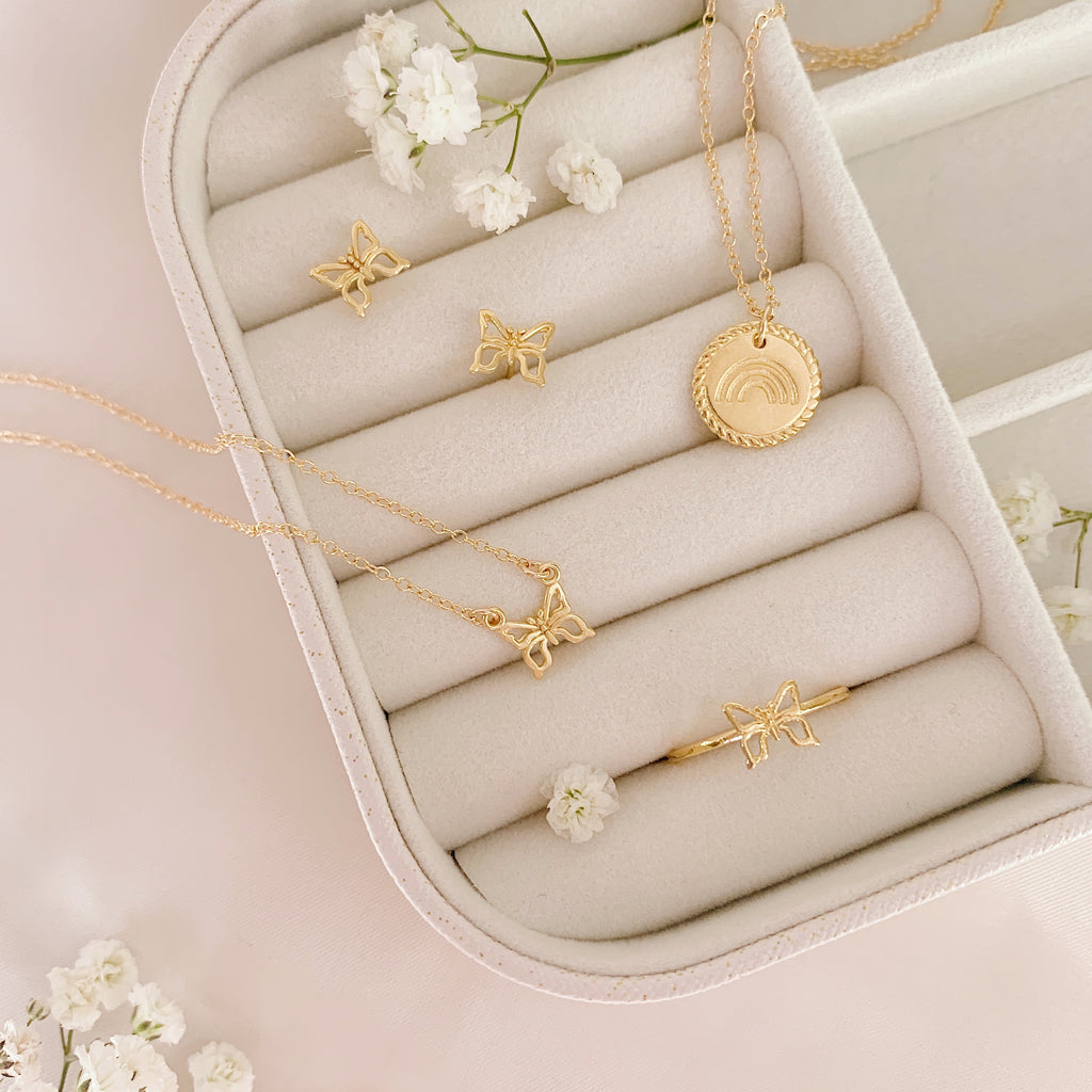 Rainbow butterfly collection in white jewelry case_dainty minimal gold jewelry, handmade in America by Katie Dean Jewelry