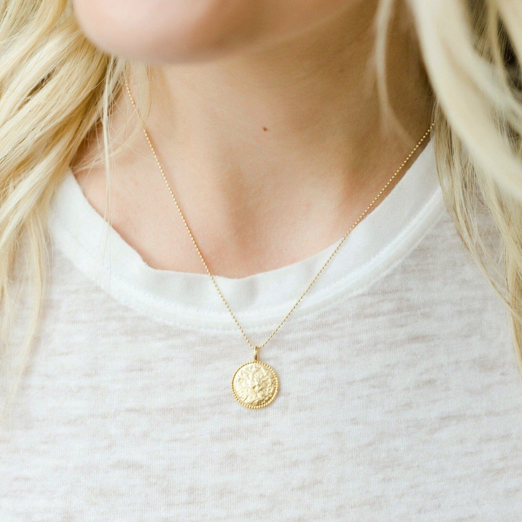 The Beaded Coin Necklace as seen on a model by Katie Dean Jewelry. Made in America.