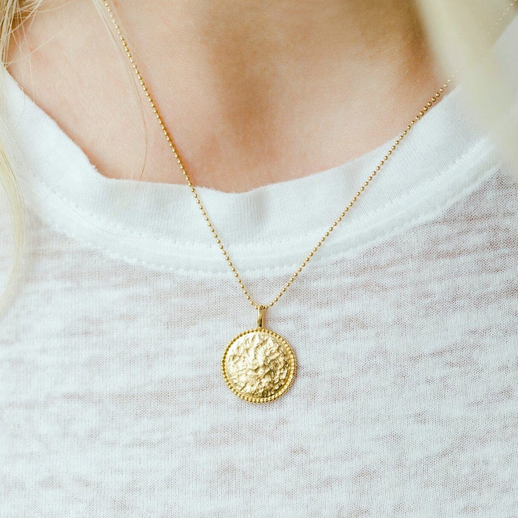 The Beaded Coin Necklace as seen on a model by Katie Dean Jewelry. Made in America.