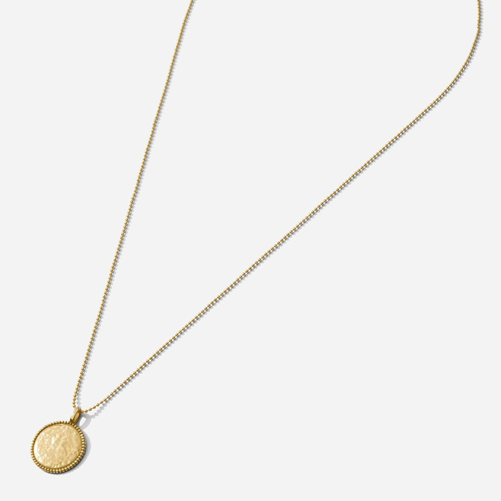 The Beaded Coin Necklace as seen on a white background by Katie Dean Jewelry. Made in America.