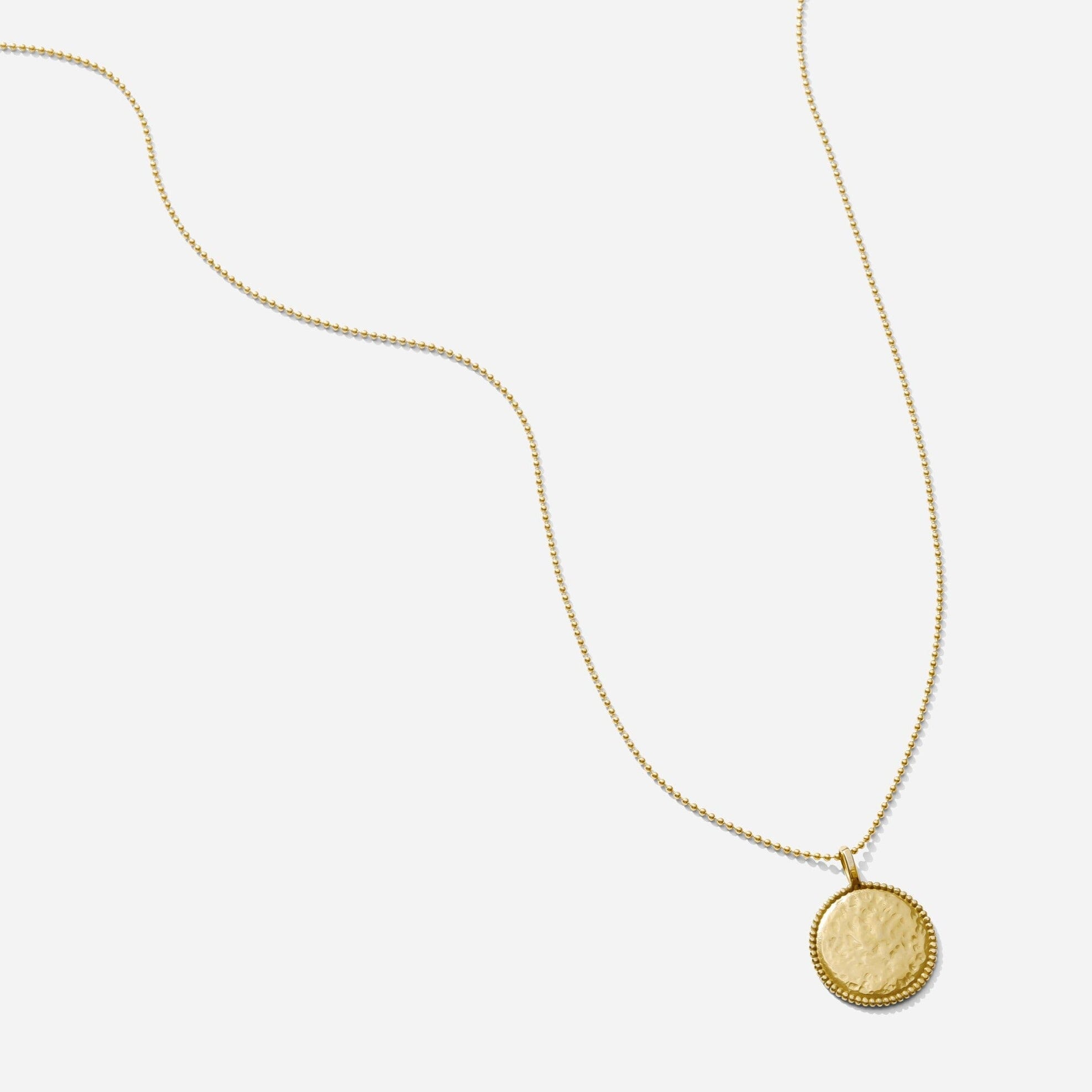 The Beaded Coin Necklace as seen on a white background by Katie Dean Jewelry. Made in America.