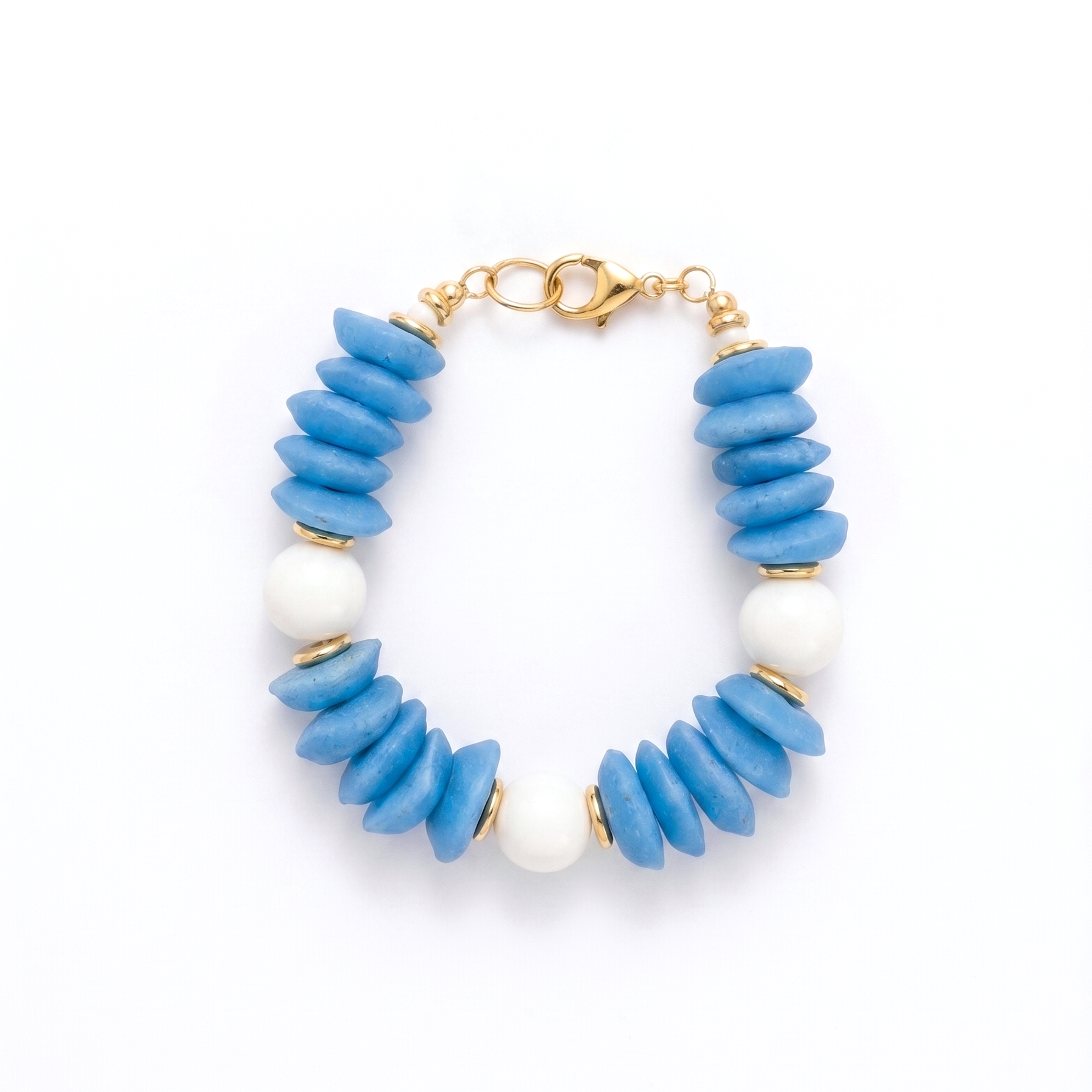 Bracelet with blue and white beads on a white background