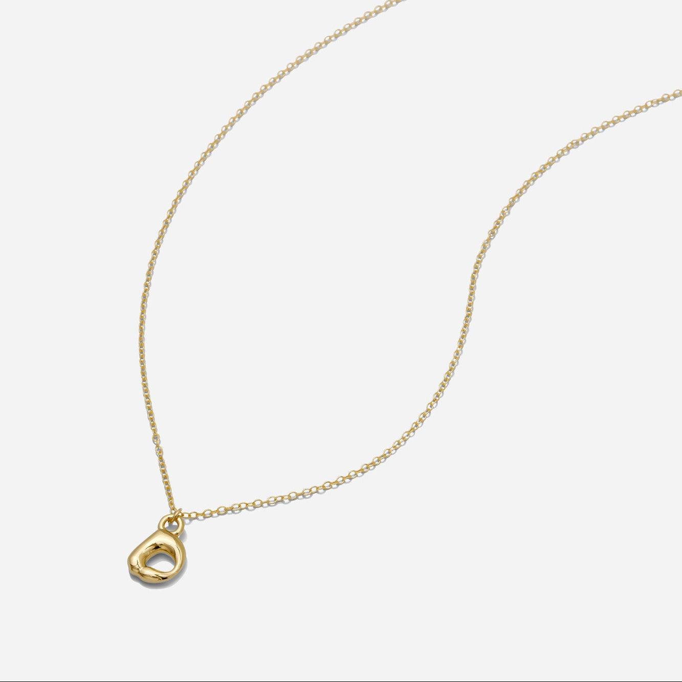 Dainty Gold puffy initial "D" pendant necklace on an 18-inch gold filled chain as seen on a white background.