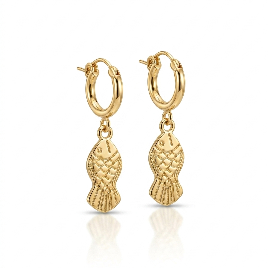 gold hoop earrings with detailed fish charm pendants on white background