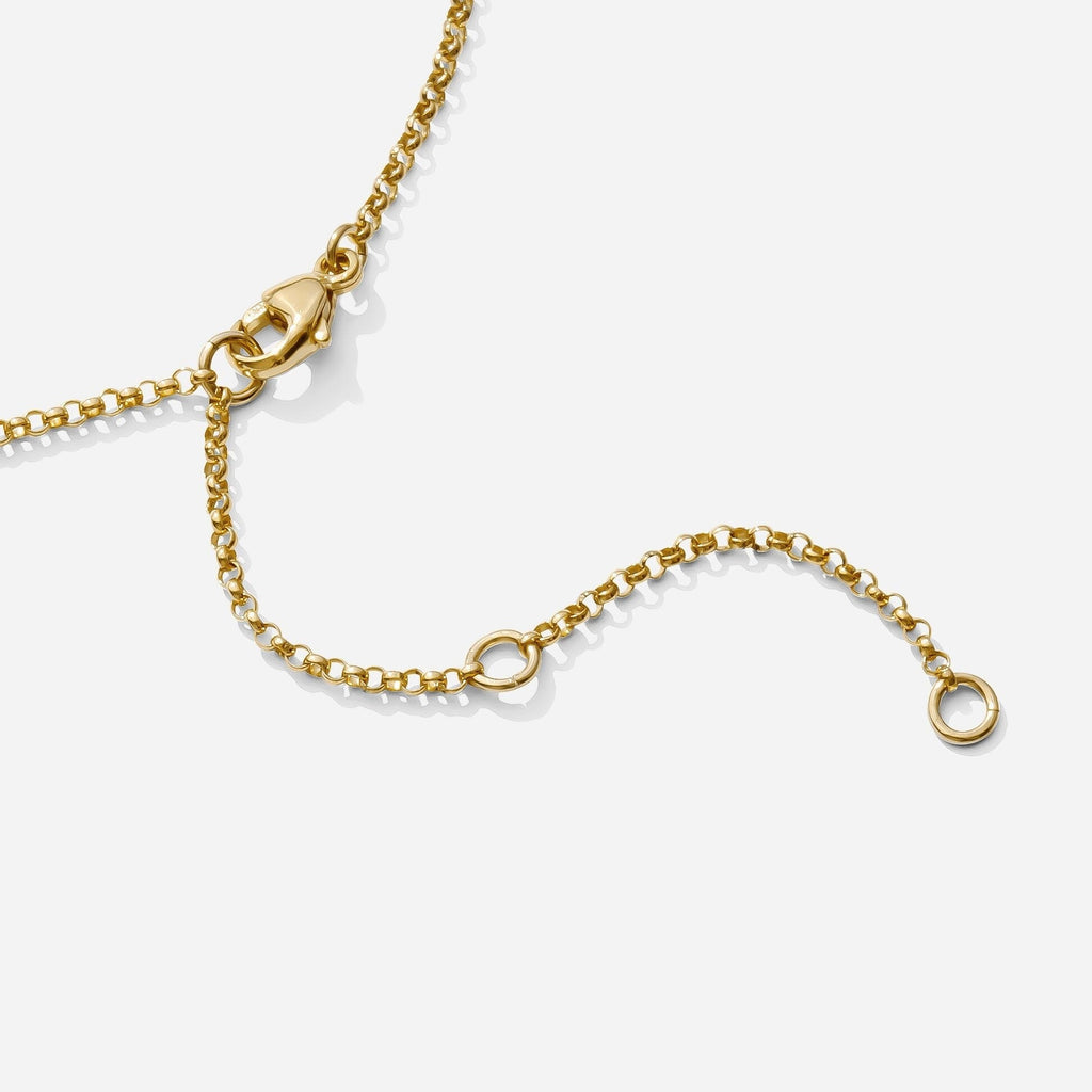The end of the Gold Rolo Anklet, showing clasp and extension clasp points, as seen on a white background by Katie Dean Jewelry. Made in America.