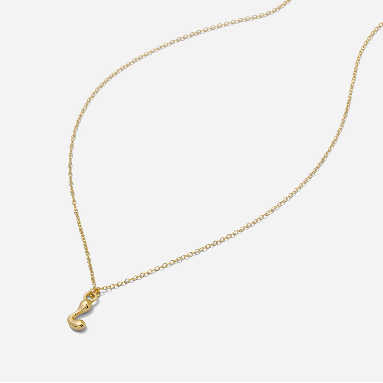 Dainty Gold puffy initial "L" pendant necklace on an 18-inch gold filled chain as seen on a white background.