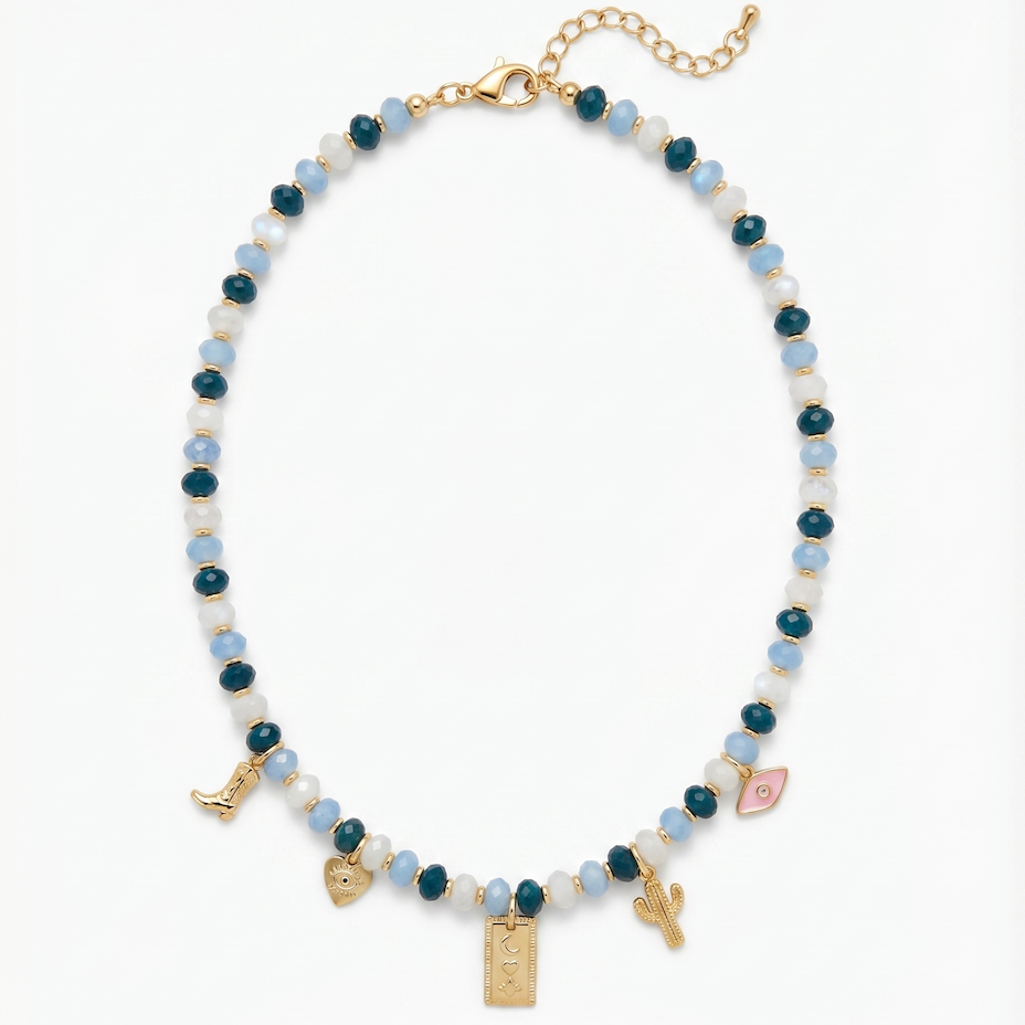 Necklace with white, blue and gold beads and charms on a white background
