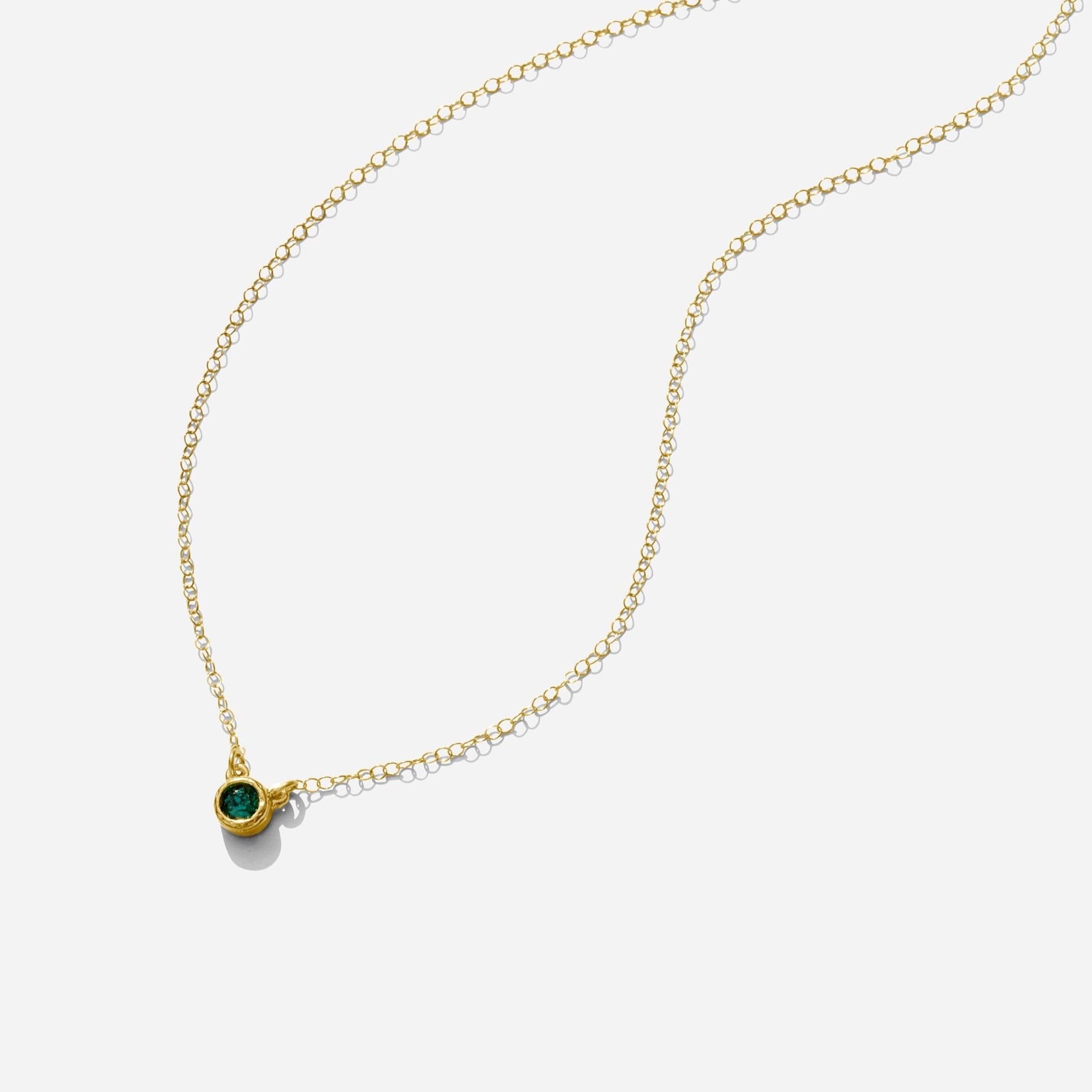 Gold May Emerald Birthstone Necklace handmade in America by Katie Dean Jewelry, as seen on a natural white background, perfect for the dainty minimal jewelry lovers.