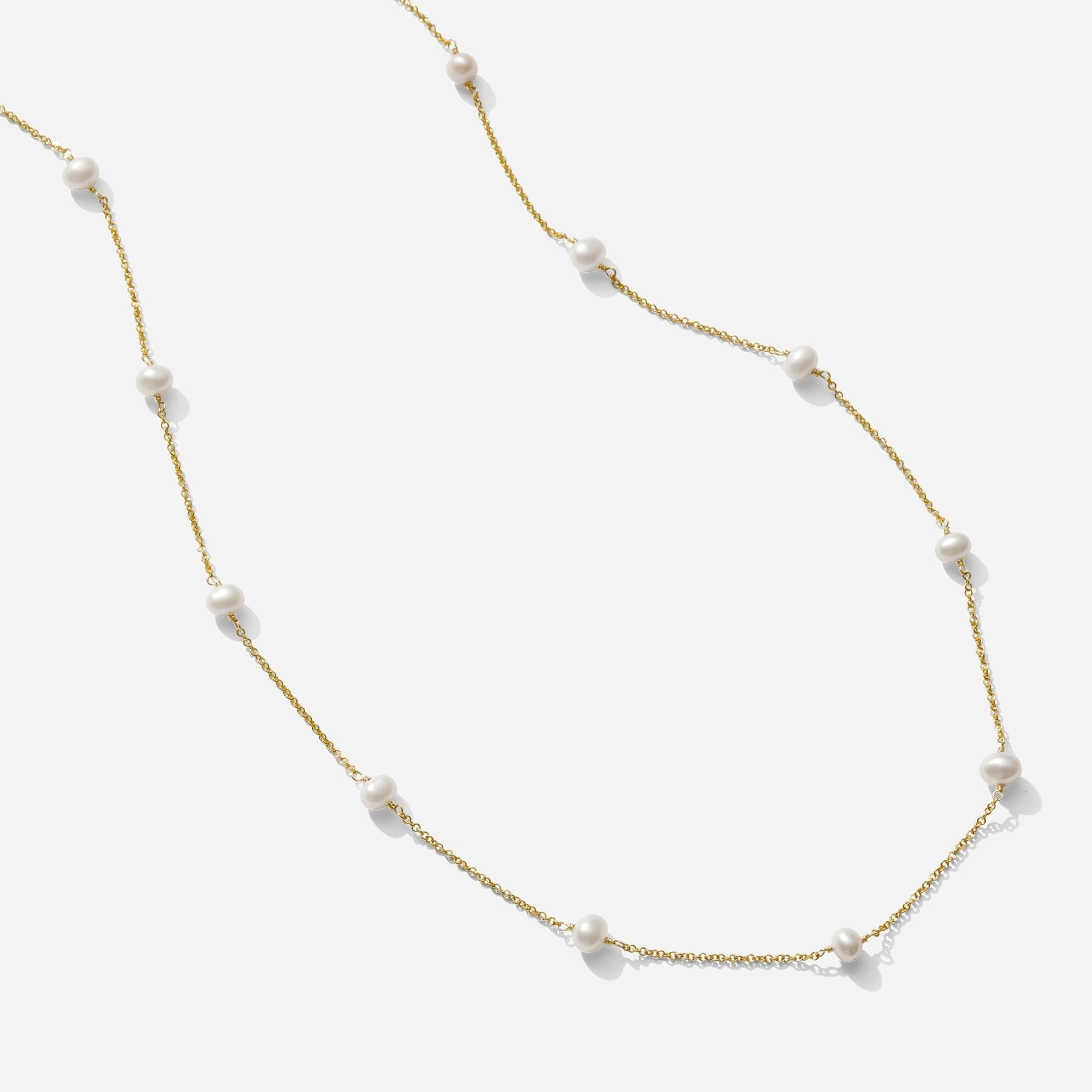 The Pearl Necklace as seen on a white background by Katie Dean Jewelry. Made in America.