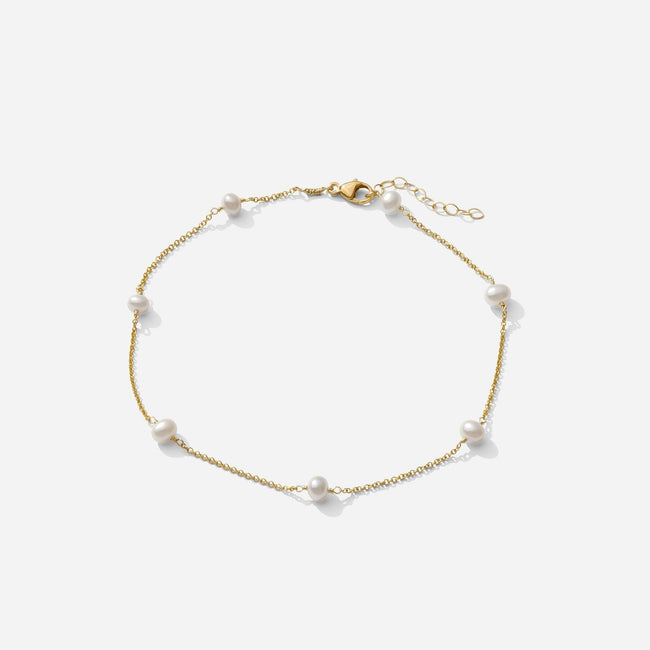 The gold Pearl Anklet as seen on a white background by Katie Dean Jewelry. Made in America.