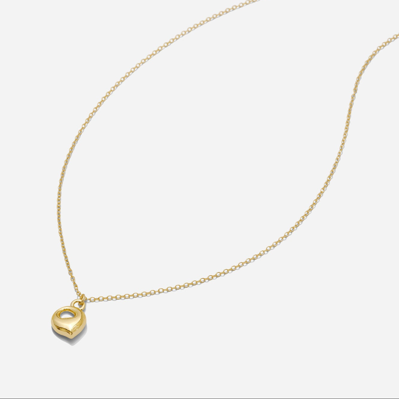 Dainty Gold puffy initial "Q" pendant necklace on an 18-inch gold filled chain as seen on a white background.