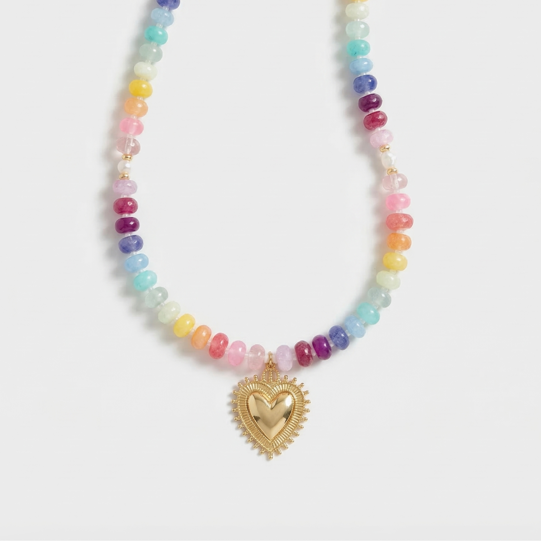 Necklace with colorful beads and a gold heart-shaped pendant on a white background